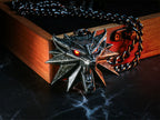 Image produit Witcher - Médaillon Wild Hunt avec yeux LED dans une boîte cadeau